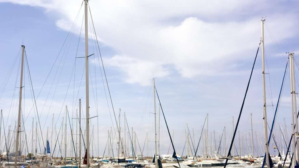 yacht brokers in Attica - marina berths at sunrise with motor yachts lying alongside near Athens